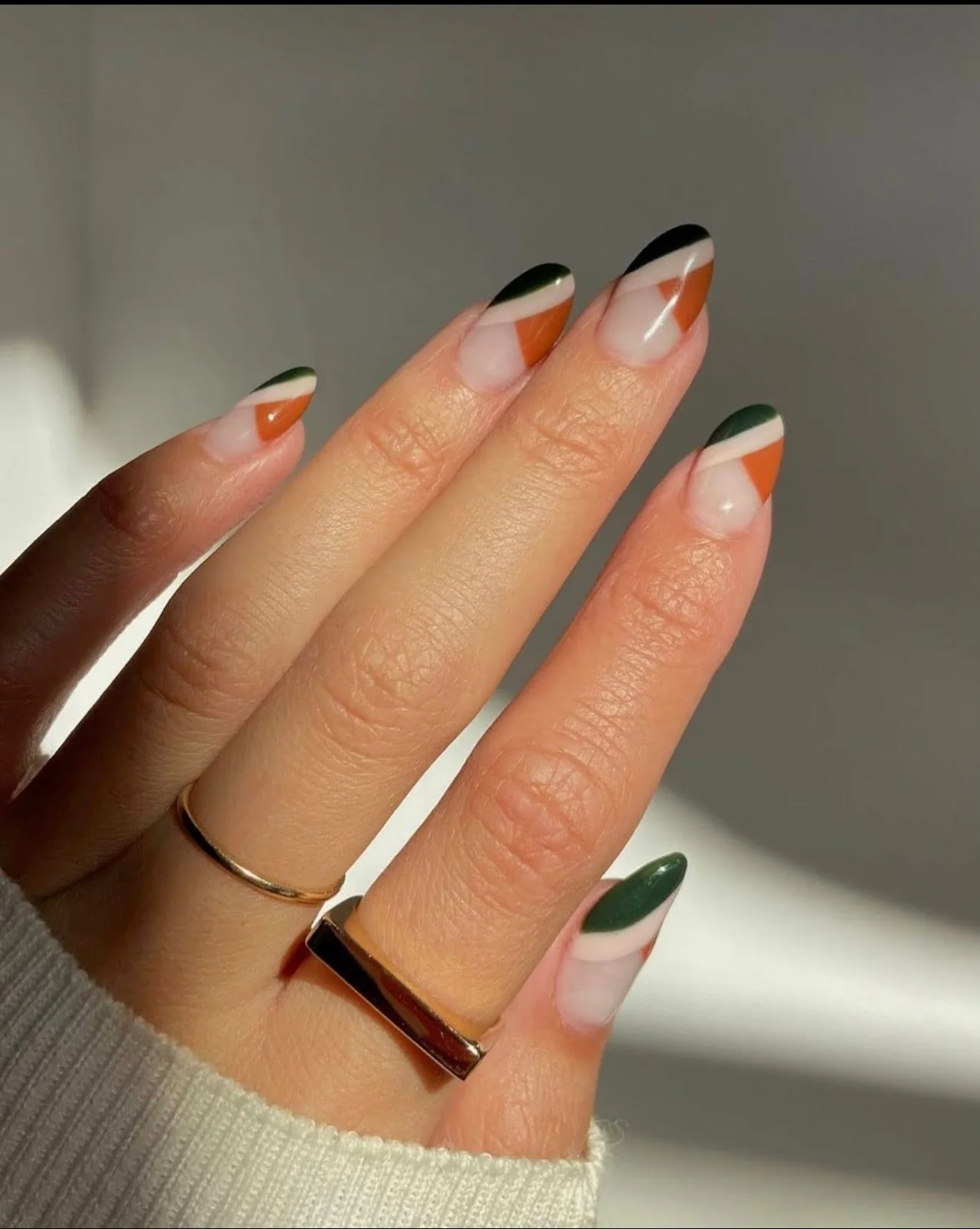 Green and white nail art detail